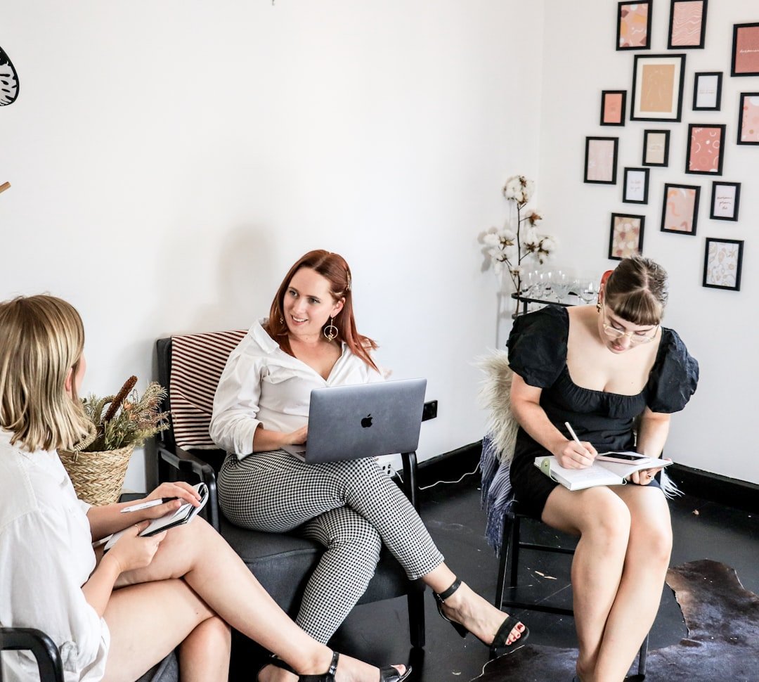 hero-gallery-01 woman-in-black-tank-top-sitting-on-black-couch-kql6cffc664