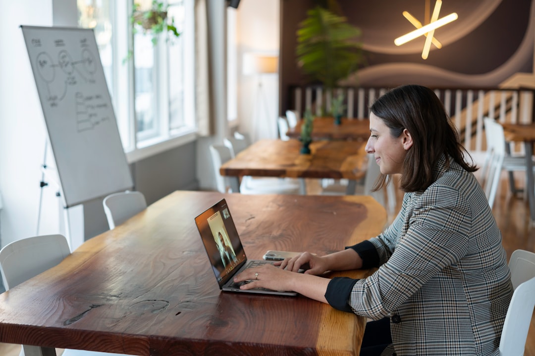 A salesperson working in an office on a virtual call